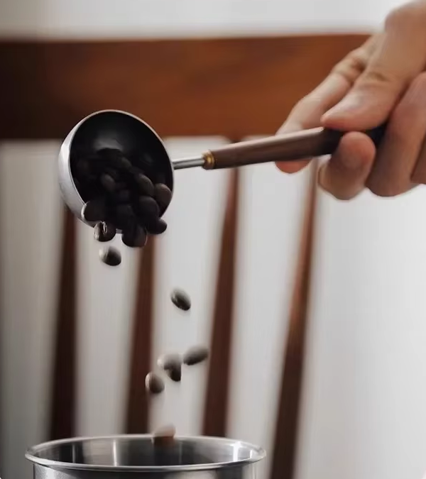 Home Barista Making Coffee Using Luxury Style Scoop Coffee Spoon With Sleek Handle Design