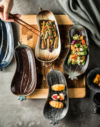 Eating Food And Side Dishes Out Of Decorative Ceramic Eggplant Shaped Serveware