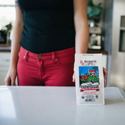 Grabbing Bag Of Floyd Farmhouse Breakfast Blend Coffee Organic Red Rooster