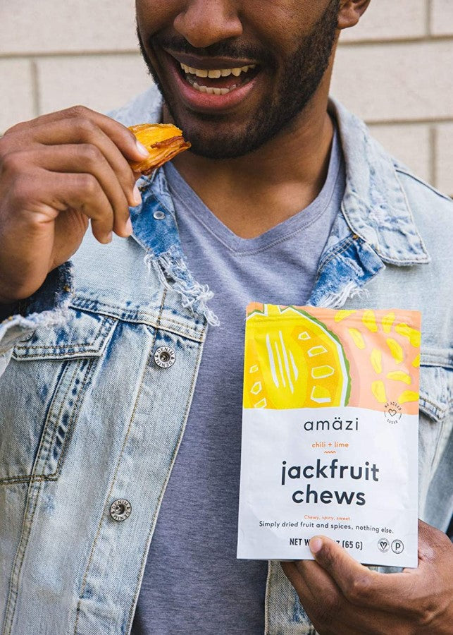 Man Eating Chili Lime Jackfruit Chews Amazi Dried Fruit Snack