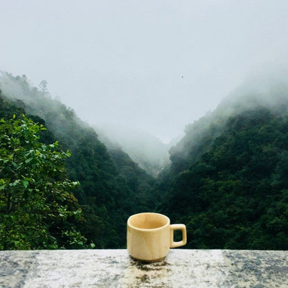 Yellow Coffee Mug Outdoors In Mountain Fog